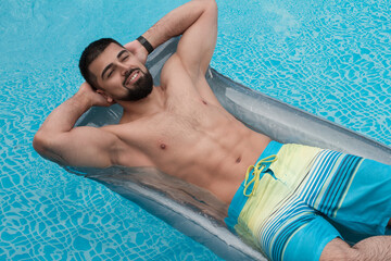 Handsome man in swimming pool
