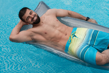 Handsome man in swimming pool