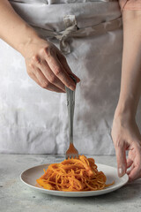 Woman are taking spoon with Italian Spaghetti . Modern Italian food concept