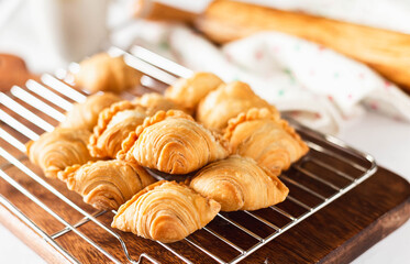 Baked golden brown Curry puff hot out of oven on cooling