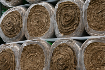 Large mineral wool thermo rolls for sheating houses and buildings to make it warm in storage. High-temperatured insulation construction materials