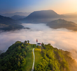 Šebrelje, Slovenia - Aerial drone view of the beautiful hilltop church of St.Ivan (Sv. Ivan...
