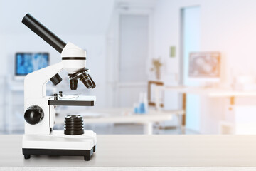 Modern microscope on table in scientific laboratory