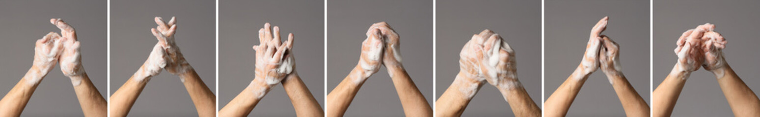 Many hands in soap foam on grey background