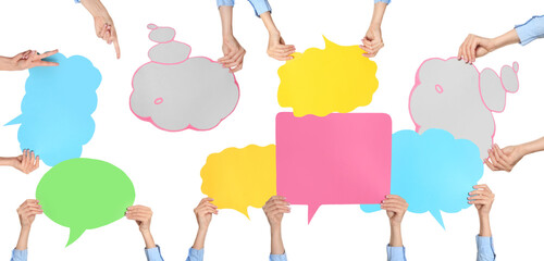 Many female hands with blank speech bubbles on white background