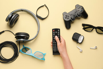 Female hand with different modern devices on color background