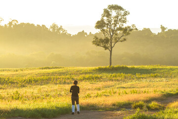 young woman walking in the field