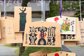 Traditional wooden prayer tablet (Ema) at Kumano Hongu Taisha in Tanabe, Wakayama, Japan.