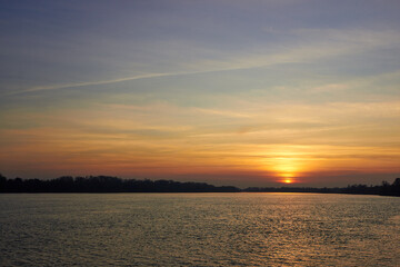 Sunset over danube river at the autumn. Evening over river landscape