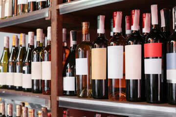 Rack with bottles of wine in store