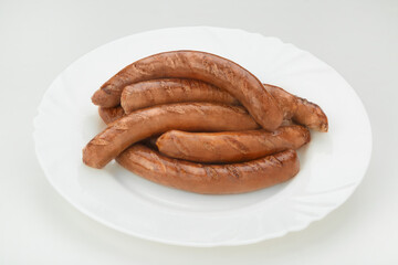 homemade sausage on a white plate white background