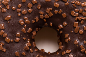 Chocolate donut on a white background close-up.