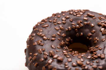 Chocolate donut on a white background close-up.