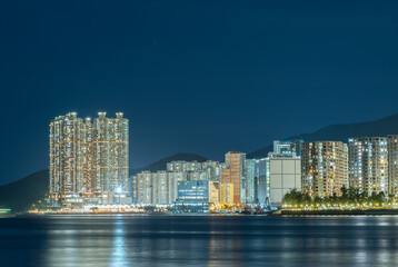 Fototapeta premium Skyline and harbor of Hong Kong city at night