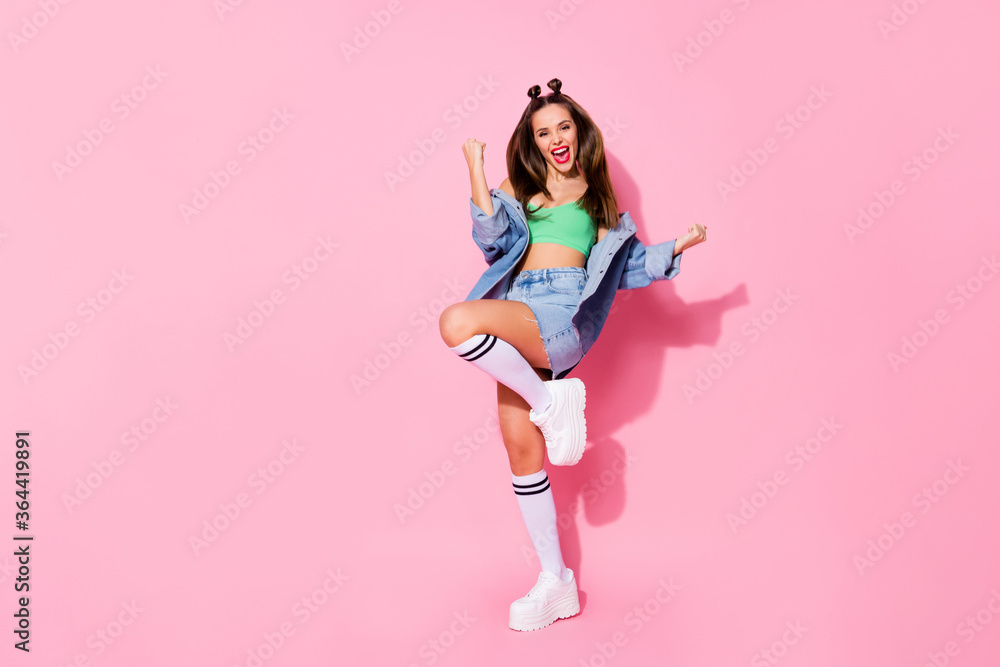 Wall mural Full length body size view of nice-looking attractive lovely glamorous trendy casual glamour slim fit tanned glad cheerful lucky girl having fun rejoicing isolated over pink pastel color background