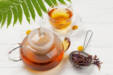 Herbal tea in teapot and cup
