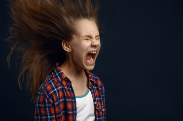 Little girl screams in studio, developing hair