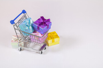 Shopping carts with gifts inside on a white background.
