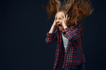 Little girl screams in studio, developing hair