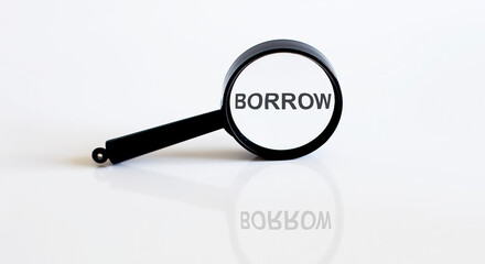 Magnifier with text BORROW on the white background