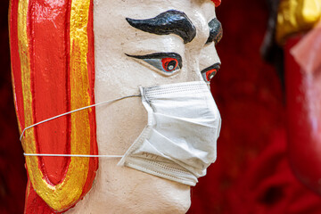 The portrait of the historical thai soldier with face mask, Wat​ Muang​ temple​ located​...