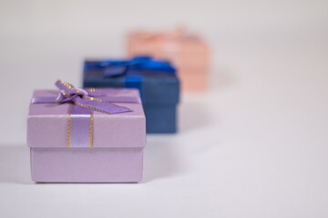 Multi-colored boxes with gifts on a white background.