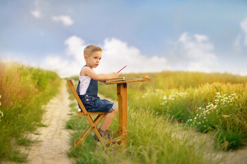 
Little boy sitting on a bench outdoor.