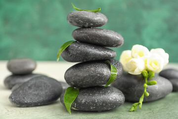 Spa stones on color background