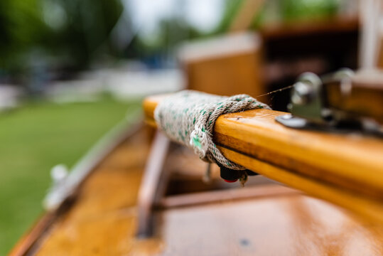 Tiller Of An Old Wooden Sailboat