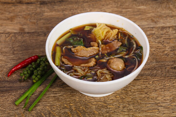 Thai style soup with meat and mushrooms