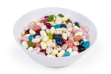 Varicolored jelly beans in bowl on white background close-up