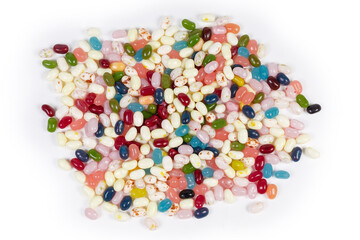 Pile of the varicolored jelly beans on white background