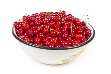 Freshly picked sour cherries in big enameled bowl close-up