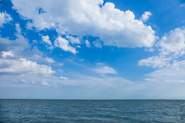 Naklejka na ściany i meble View of beautiful sky with clouds near sea