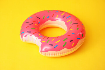 Inflatable ring on color background