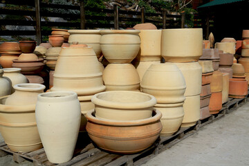 Finished pottery in a pottery workshop. Ceramics production. Craft, art.