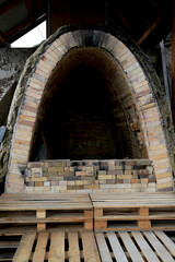 Fototapeta na wymiar Refractory brick kiln for firing clay products in a pottery workshop