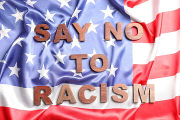 Text SAY NO TO RACISM on national flag of USA