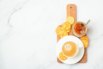 jam with crackers and coffee top view.
