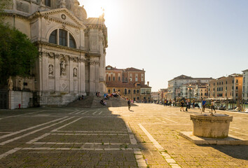 Obraz premium Venice, Italy, april 2018. A back light shot of the little square in front of the beautiful church 