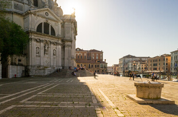 Obraz premium Venice, Italy, april 2018. A back light shot of the little square in front of the beautiful church 
