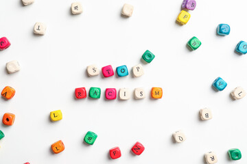 Cubes with text STOP RACISM on white background