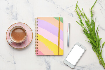 Composition with notebooks and cup of coffee on white background