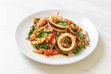 stir fried holy basil with octopus or squid and herb
