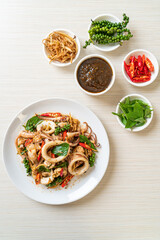 stir fried holy basil with octopus or squid and herb