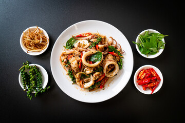 stir fried holy basil with octopus or squid and herb