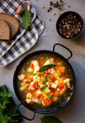 Vegetable soup with cauliflower, laurel and other vegetables