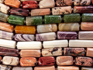 background of beads made from various natural minerals