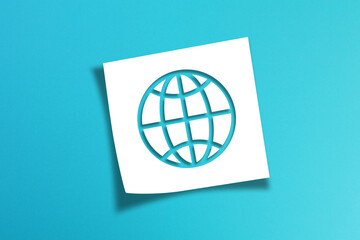 Note paper with world symbol on blue background