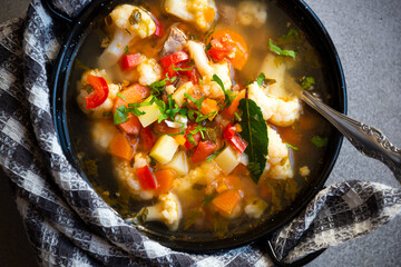 Vegetable soup with cauliflower, laurel and other vegetables